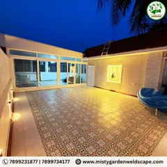 The completed terrace at Skylark Greens, seen here at night. The warm lighting highlights the beautiful patterned floor tiles and the clean lines of the enclosed space, creating a cozy and inviting ambiance.