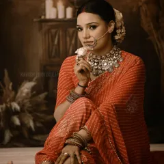 A full-length artistic portrait from the same series, showcasing the beautiful drape of the saree and the subject's graceful pose.