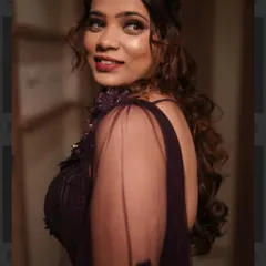 A beautiful close-up of the sangeet glam. The focus is on her glowing skin and a warm, smokey eye that makes her look absolutely captivating.
