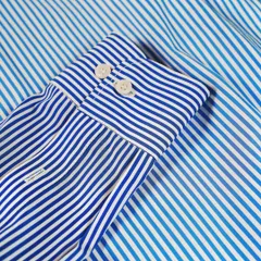 A classic blue and white striped shirt is a wardrobe staple. We use high-quality, breathable cotton to ensure it's as comfortable as it is stylish.