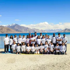A group photo with my students at Pangong Lake in Ladakh. Practicing together in such a majestic landscape creates a lasting impact and strengthens the team's collective wellness journey.