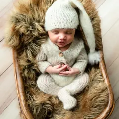 Just like a little bunny. This soft, knit outfit with a sleepy cap is perfect for creating a cozy and adorable look.