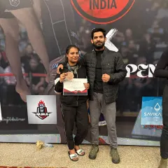 A proud coach with his student after she won a bronze medal at the ADCC Nationals. This is a result of her hard work and the team's support.