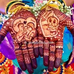 Here you can see the rich, dark stain of a completed baby shower design. The artwork features a family portrait and a cute baby with a bottle, showcasing the beautiful final color of my organic henna.