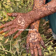 A full view of the engagement mehendi, showing how the personalized elements like the ring and the name are integrated into the overall floral design.