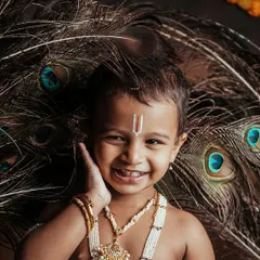 Look at that smile. My themed kids photoshoots, like this little *Krishne* session for Janmashtami, are all about capturing pure joy. I create a fun environment where kids can be themselves, resulting in portraits full of personality.