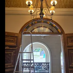 A behind-the-scenes look at the Mangalore family home project, showing the intricate details of the arched doorway with stained glass and carved wooden doors. This was a dream project with a lot of experimentation.