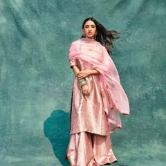 The lovely Akansha Ranjan Kapoor in a shimmering pink sharara set from Raw Mango for the 'Dastoor' music video. The look is soft, romantic, and perfectly captures the mood of the song.