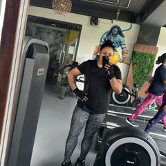 A quick selfie from me during a workout. You can see our gym's energetic vibe in the background, with the Mahadeva mural that inspires us to find our inner strength.