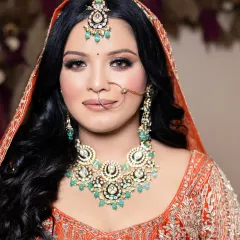 A close-up of a flawless bridal look created by one of my students. Notice the perfectly blended eyeshadow, sharp contour, and radiant skin finish, all techniques we cover in-depth.