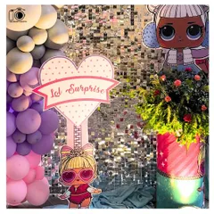 A close-up of the 'LOL Surprise' themed decor, featuring a glittering sequin backdrop that makes every photo sparkle. We work with top decorators to create the perfect photo setting.