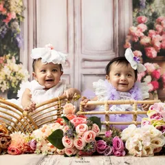 Another delightful shot of these twin babies during their floral-themed sitter session. Their happy expressions and cute outfits make for an unforgettable portrait.