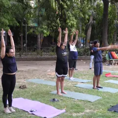 Starting our outdoor session with a collective stretch towards the sky. Practicing Tadasana (Mountain Pose) together helps ground our energy before we begin to flow.