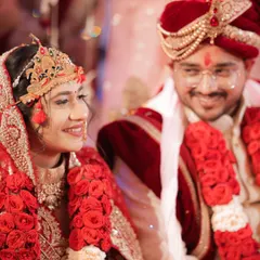 A candid shot of the bride and groom during their ceremony. The groom's loving smile towards his bride captures a genuine, unscripted moment of happiness.