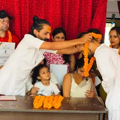 The closing ceremony is a special time for all of us. Here, I am placing a garland on a graduating student, a gesture of respect and blessing for his future as a teacher.