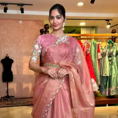 Here is a complete look from my 'Kamalam' collection, inspired by the serene beauty of the lotus flower. This elegant pink tissue organza saree features delicate scallop edges and is paired with a blouse showcasing intricate floral embroidery on the sleeves and neckline. It’s a perfect example of how a simple inspiration can become a sophisticated and modern statement.