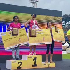 As a coach, I lead from the front. Here I am on the podium after a first-place age category finish in the Bengaluru Half Marathon. I bring the same dedication to my own races as I do to coaching you for yours.