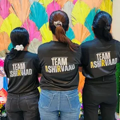 The back of our official team t-shirts. We are a unified team, proud to represent Team Ashirvaad at every rehearsal, event, and celebration.
