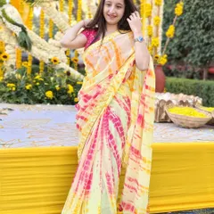 Dressed for a Haldi ceremony in Jaipur. The vibrant yellow decor and my traditional saree reflect the festive and joyful atmosphere I help create for wedding functions.