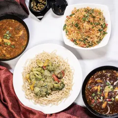 Can't decide between noodles or rice? Have both. This spread showcases our popular Indo-Chinese offerings, including savory noodles, flavorful fried rice, and rich gravies, perfect for sharing.