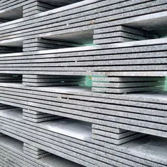 A closer look at the stacked granite off-cuts used to create the jaali. This exploration of material allows us to innovate with sustainable building practices while achieving a unique, monolithic texture for the home.