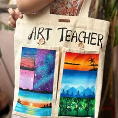 Here I am holding the finished custom-painted tote bag. It's a great example of a personalized, practical gift for any art lover or teacher. The design can be customized to whatever you like.