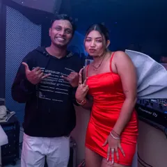 Posing with a fellow artist during a New Year's Eve event. I often collaborate with other performers to make the night even more special.