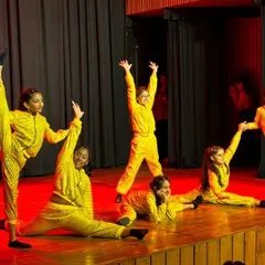 This is a snapshot of pure joy and technical skill from our Recital 2024. Our advanced kids' batch showcases their flexibility and stage presence in their vibrant yellow costumes, owning the stage with confidence.
