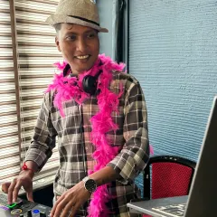 Having fun with the retro theme, complete with a fedora and a pink feather boa. I love to get into the spirit of the party.