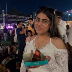 A happy customer enjoying a slice of our Nutella Strawberry cake at The Lil Flea. Her smile says it all. These are the moments we work for.