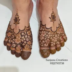 A beautiful floral mehndi design for feet, with a delicate lotus motif extending from the main pattern.
