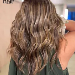 This is that perfect, Pinterest-worthy "bronde" balayage. We used a bleach and tone method to weave buttery, bright highlights into a natural brown base, creating a sun-kissed look with tons of dimension and movement.