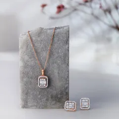 A minimalist composition featuring a diamond pendant and earring set from Orra. I used a simple stone prop and a soft, out-of-focus background to create a serene and sophisticated mood.