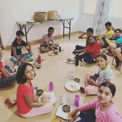 The best reward after a week of hard work at our summer camp. Students enjoy a well-deserved meal of chole bhature together.