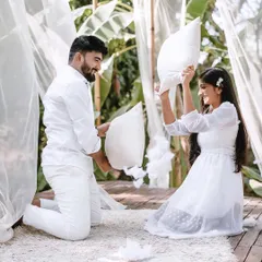 Pre-wedding shoots should be fun! A playful pillow fight is a great way to capture genuine laughter and create lighthearted, joyful memories.