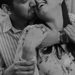 A black and white close-up filled with laughter and love. By stripping away the color, we focus entirely on the emotion of the moment: the crinkle of their eyes, the wide smiles, and the warmth of the embrace.