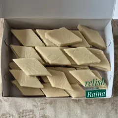 A box of my homemade Kaju Katli, made without any milk powder. I use only high-quality whole cashews and sugar to create this fresh, soft, and authentic sweet that simply melts in your mouth.