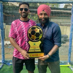 As head coach, holding the Under-15 Champions trophy from the Sportyhead Premier League in Malad. It's a proud moment seeing the team's commitment pay off.