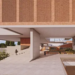 A design for a school that emphasizes open, interactive spaces. The architecture itself, with its connecting bridges and shaded plazas, is designed to foster a sense of community and learning.