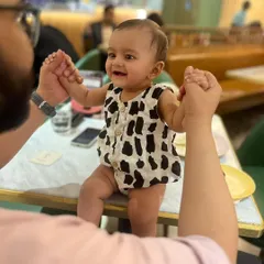 Capturing those precious, happy moments. This little one is all smiles in our black and white printed cotton romper. I make sure my infant wear is incredibly soft on delicate skin and easy for parents to manage, with simple openings for quick changes.