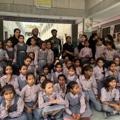 A group photo with the students after a self-defense workshop at a local school. It's important for me to give back to the community.