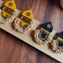 These temple-style earrings are one of my favourite designs to make. I combine fabric with intricate golden pieces and clusters of pearls to create a traditional look that is still lightweight and comfortable to wear.