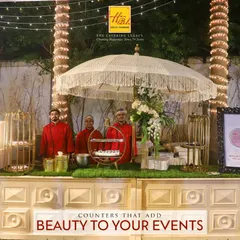 Our counters are designed to add beauty to your events. This elegant dessert counter with a decorative umbrella is a perfect example of our stylish setups.