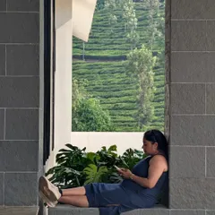 Our co-founder, Komal, caught in a quiet moment during a site visit in the lush hills of Wayanad. Even on a break, she's surrounded by the green views that inspire our work.