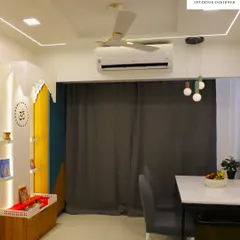 A modern and colorful mandir design, using a combination of wood, yellow, and blue panels to create a unique and vibrant prayer space.