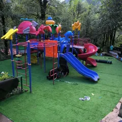 This is from a large project at the Nainital Eco Cave Garden. I installed durable, soft-feel artificial turf across the entire children's park, making it a safe, clean, and mud-free play zone for kids, no matter the weather.