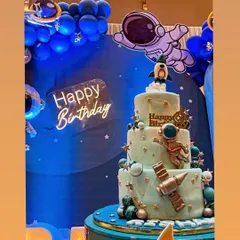 A multi-tiered space exploration cake designed for a grand birthday bash. Featuring fondant astronauts, planets, and a rocket ship, this cake was the highlight of the outer space-themed party.