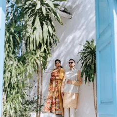 A serene moment during a Haldi function. The couple is dressed in beautiful yellow and cream outfits, perfectly complementing the sunny, relaxed vibe of their pre-wedding celebration.