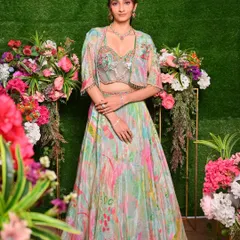 This Mehendi or Sangeet look is fresh and vibrant, with makeup tones that pick up the beautiful colors in the floral lehenga. The focus is on glowing skin and bright, happy energy.