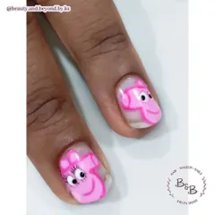 A close-up of the hand-painted Peppa Pig nail art. Capturing the details of cartoon characters is a fun challenge that I love teaching in my advanced classes.